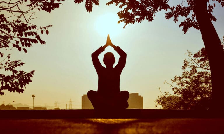 Silhouette of a Person in Yoga Pose
