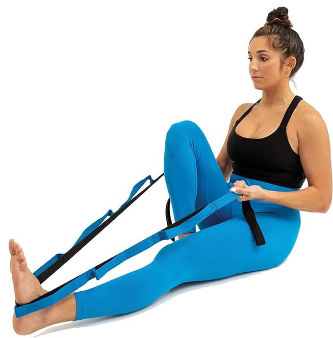 woman stretching using a yoga strap